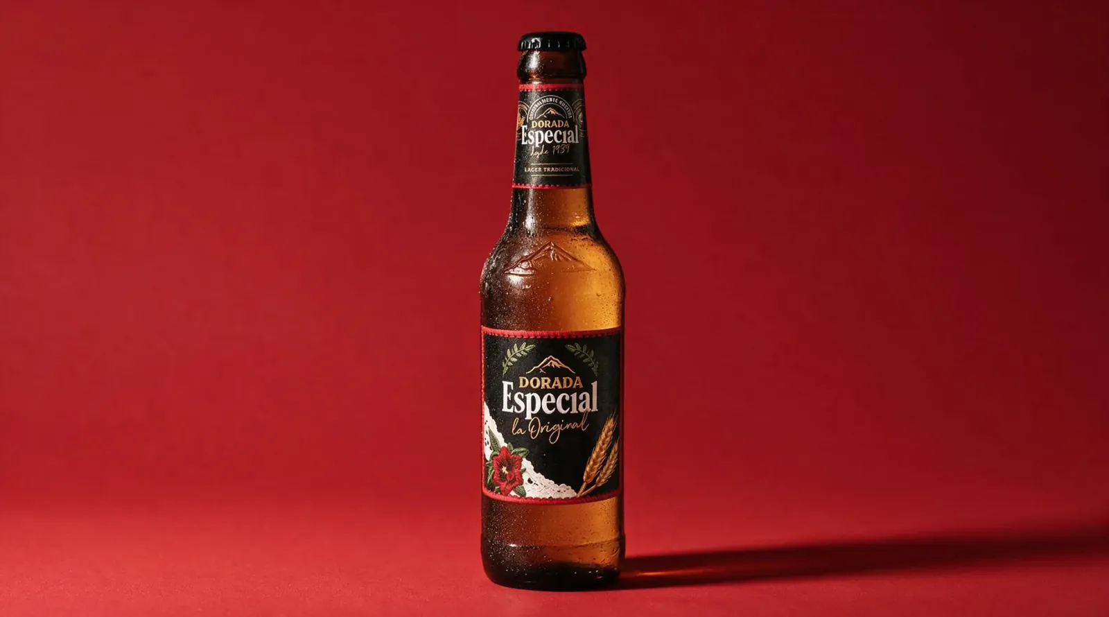 Dorada Especial beer bottle on a red background