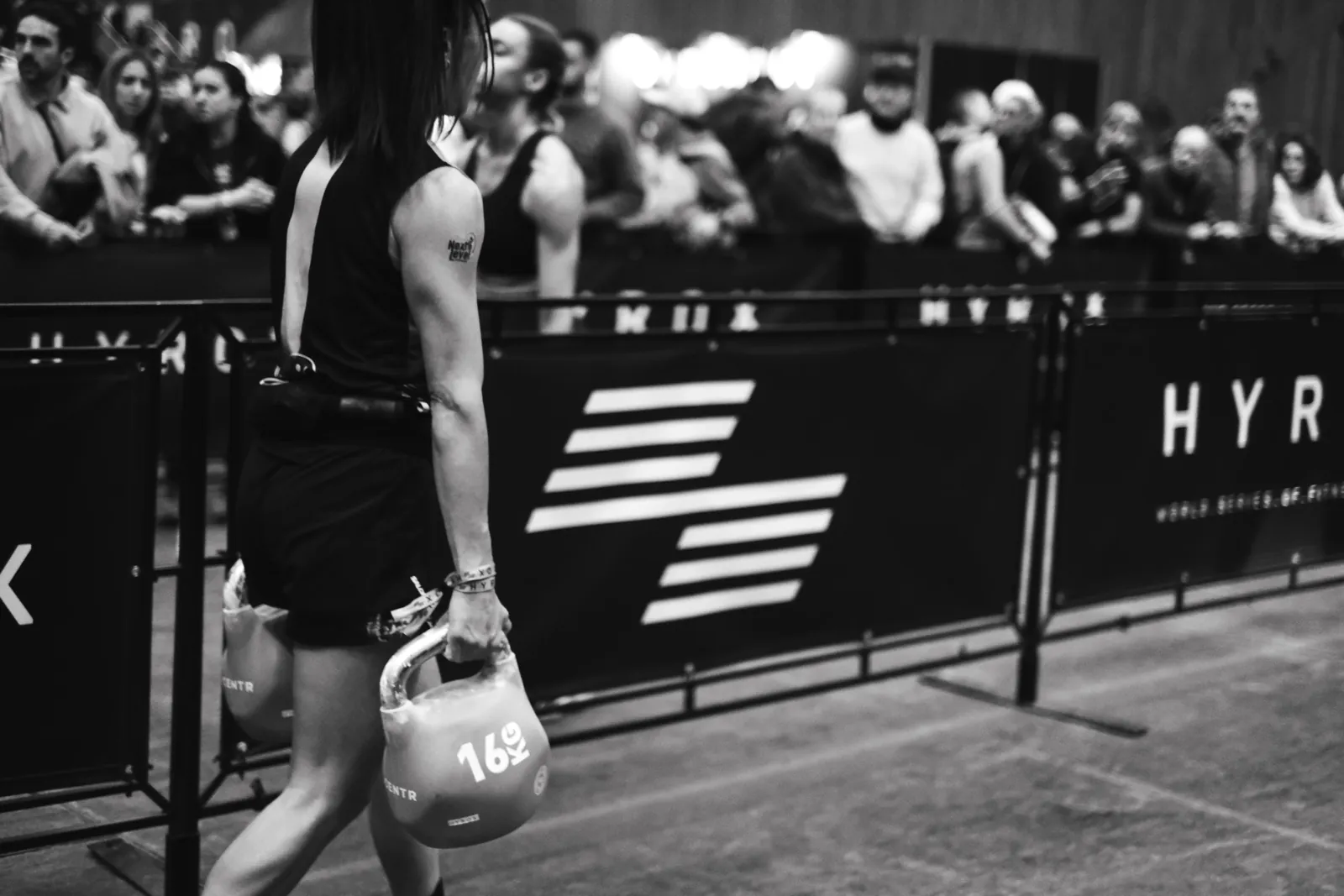 Black and white photo of an athlete at a fitness event