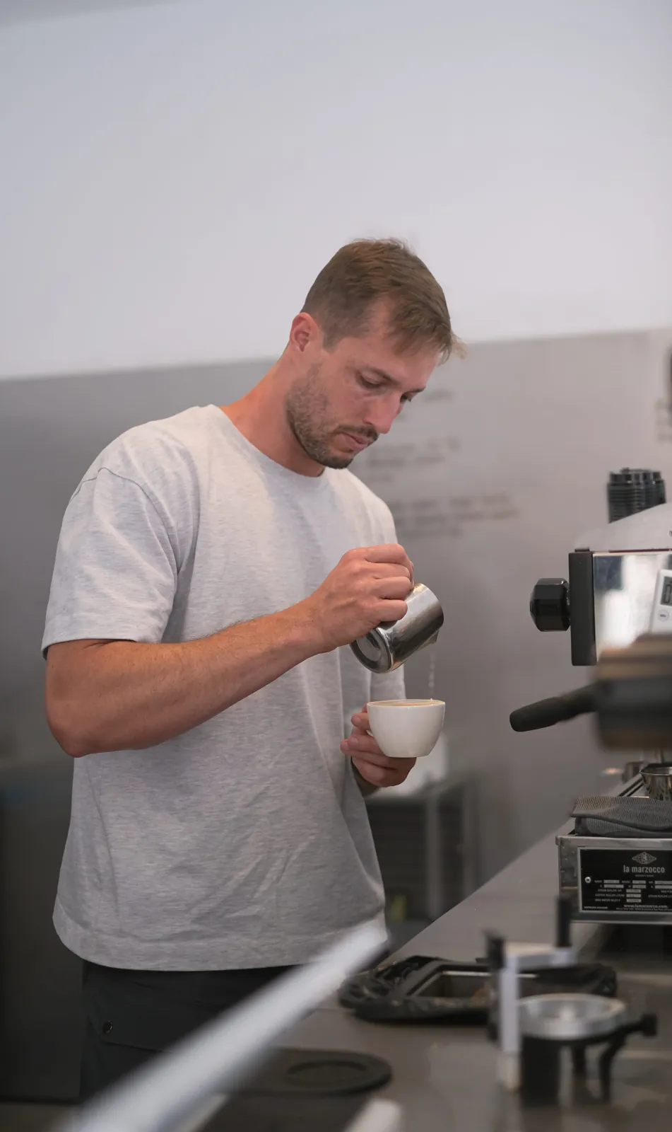 Barista preparing coffee at a counter